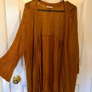 2/3 sleeve over tunic. Rust color.